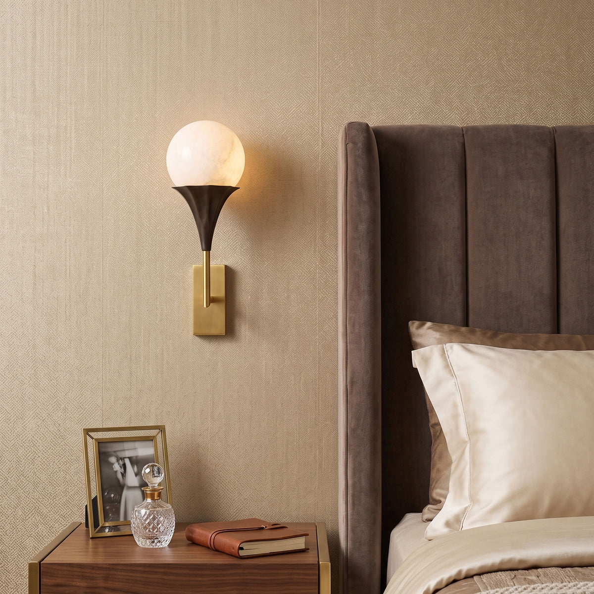 Corliss Alabaster Globe Wall Sconce mounted on a wall