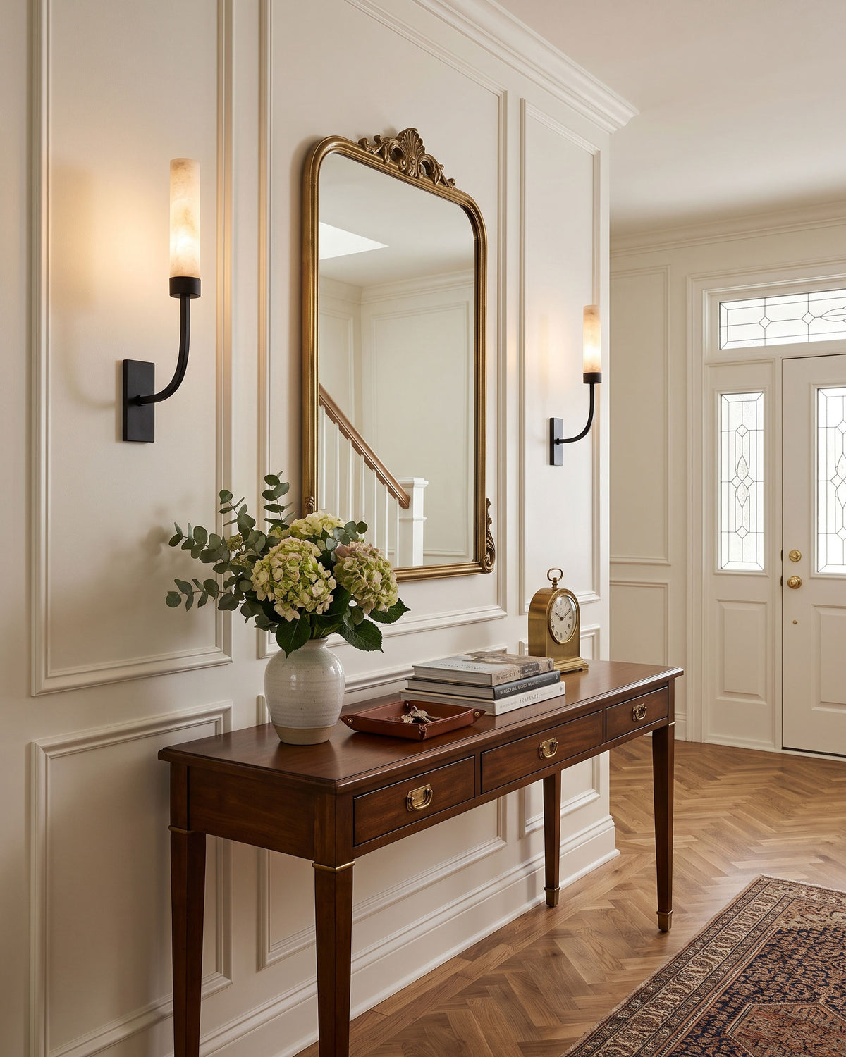 Stellan Alabaster Wall Sconce lit in a room setting